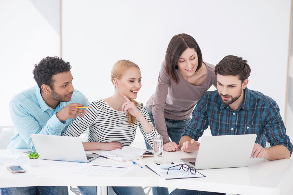 Picture of employees working together on a training project.