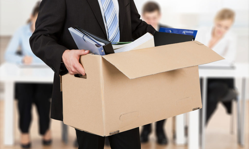 Picture of an employee leaving following the office, something that happens following employee resignations.