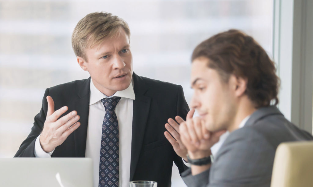 A business manager trying to deal with a good employee who has a bad attitude.