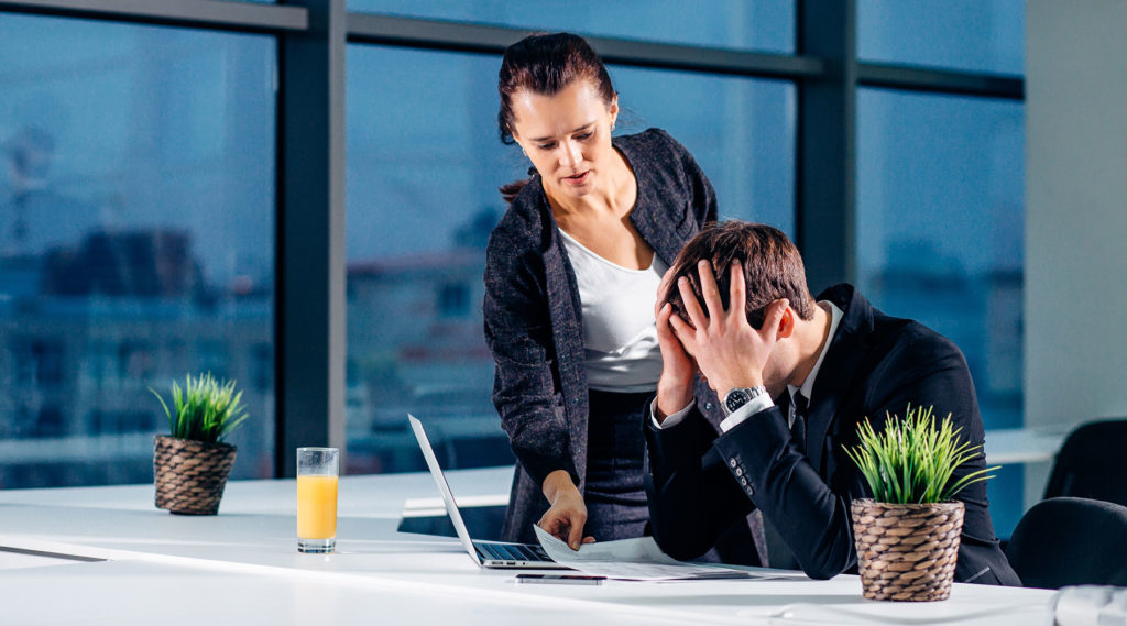 photo of business people looking stressed out and upset