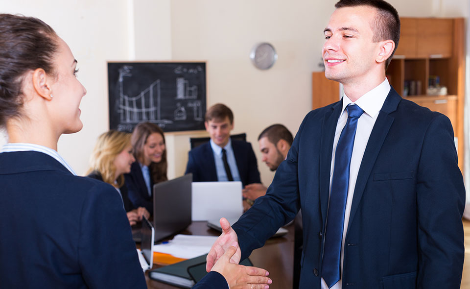 A picture of a new hire at the end of the onboarding process.